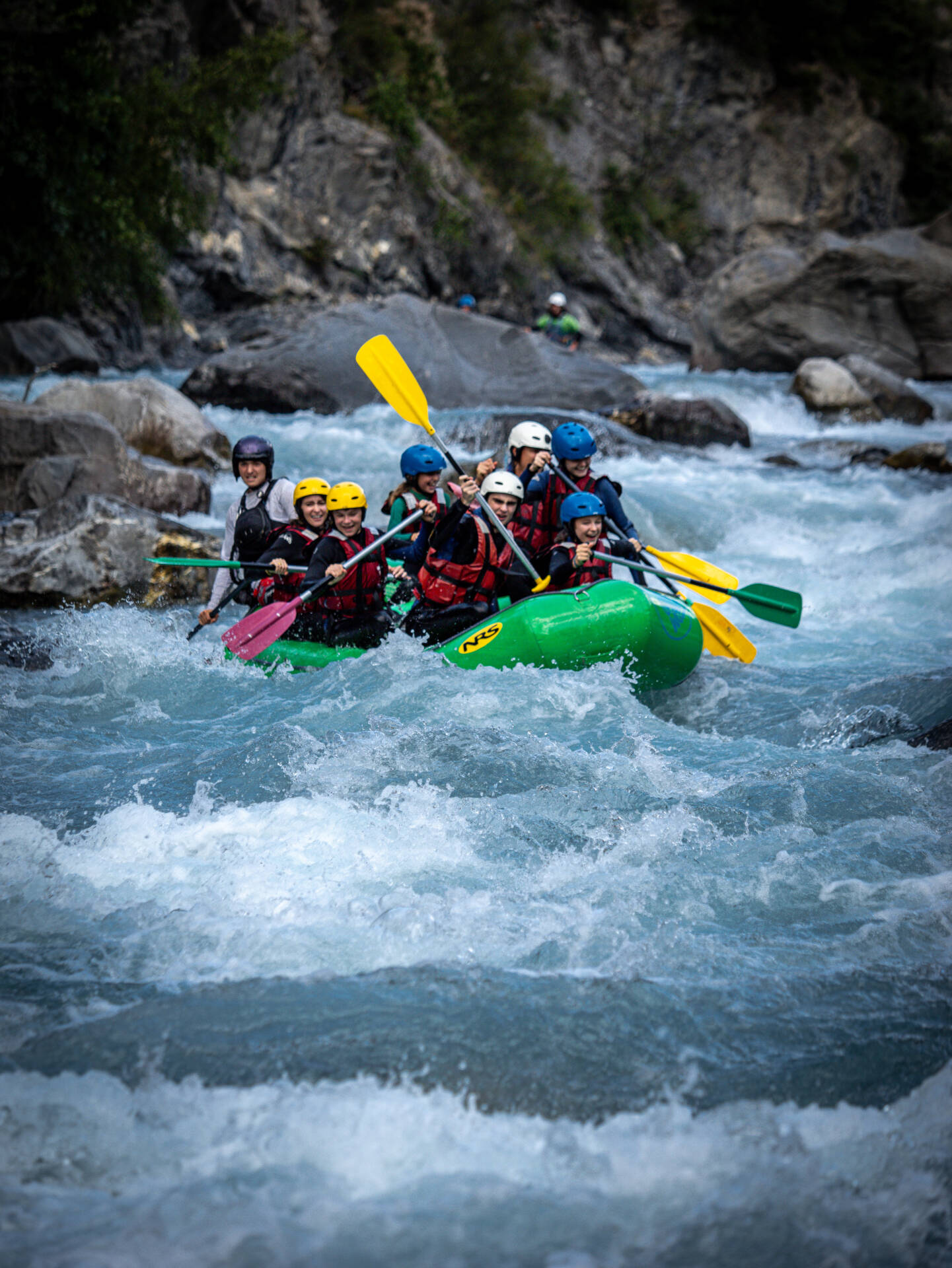 Team rafting; happy crew on the river.